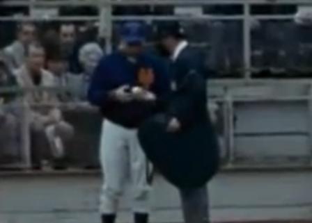 Mets Manager Gil Hodges and Umpire Lou DiMuro examine the ball that allegedly struck batter Cleon Jones in game five of the 1969 World Series