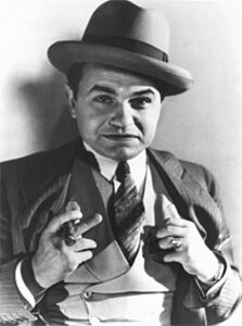 An image of actor Edward G Robinson portraying a 1930's gangster